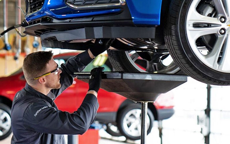 Service employee working on a car